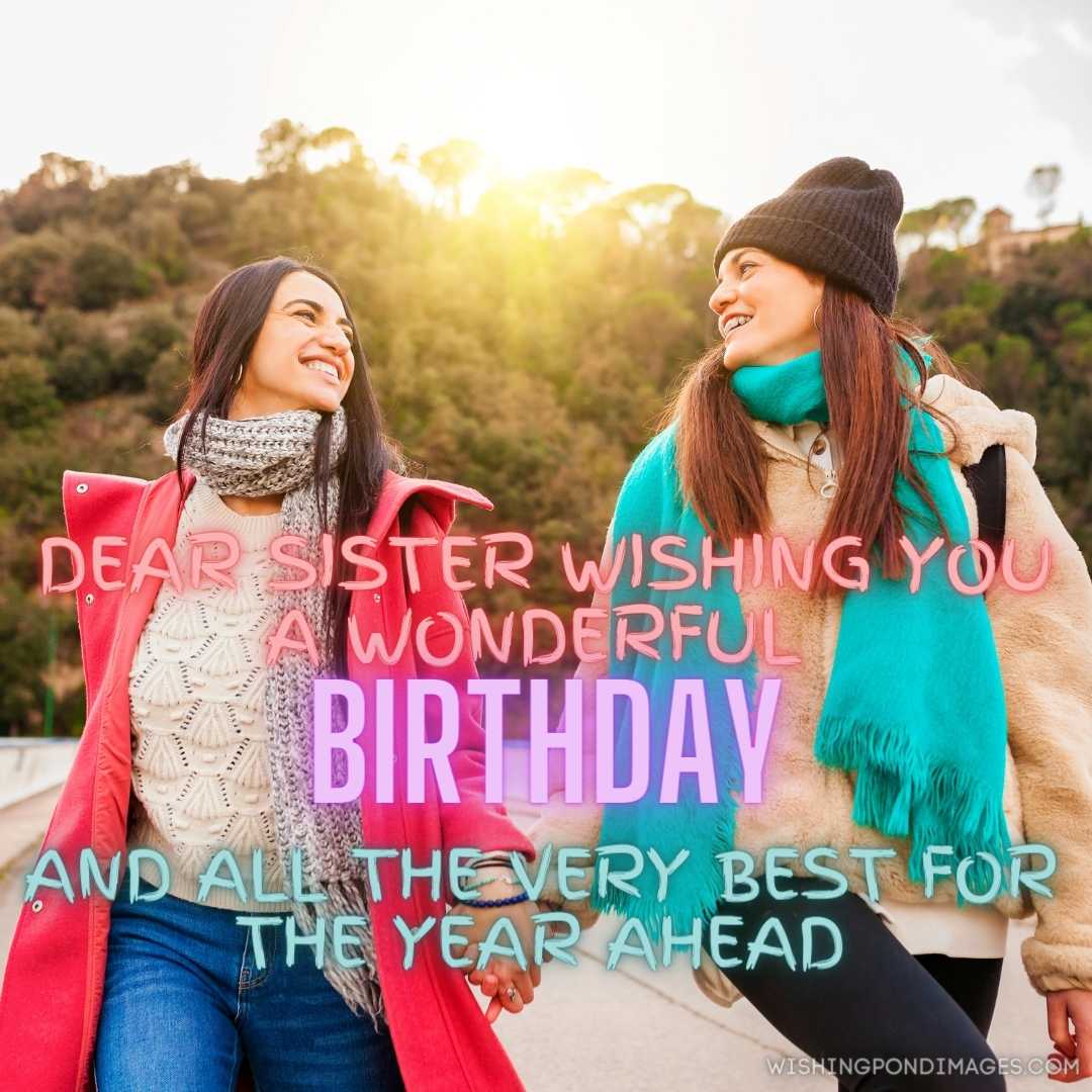 two cheerful sisters holding hands walking on a bridge. Happy Birthday Sister Images